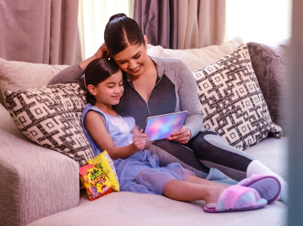 Family relaxing with a tablet